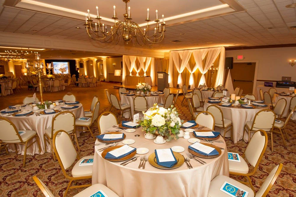 Corporate Event Room with Decorated Tables and Chairs