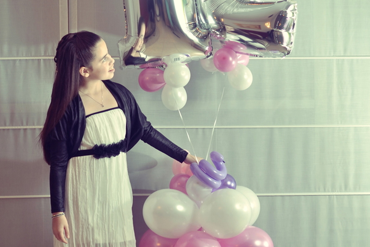 Girl Holding Birthday Balloons